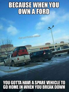 cars parked in a parking lot with the caption because when you own a ford, you got a spare vehicle to go home in when you break down