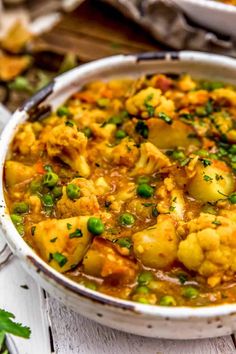 cauliflower potato curry in a white bowl