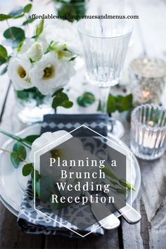 a table set with flowers and napkins for a brunch wedding reception in white