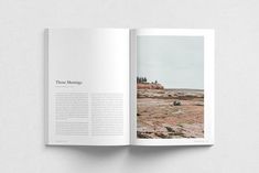 an open book with a landscape photo on the front and back cover is shown in white