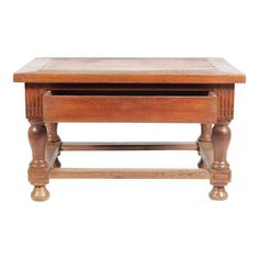 an old wooden table with one drawer on the top and two legs at the bottom