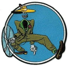 a patch with an image of a man falling from the sky, wearing a yellow hat