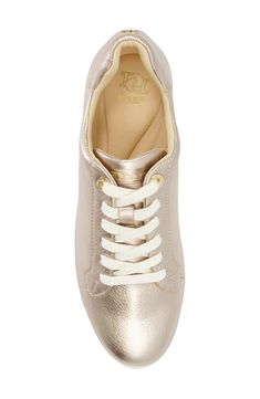 A padded heel and low-profile silhouette distinguish a street-savvy sneaker lofted by a chunky platform for statement-making appeal. 2" platform Synthetic or textile and synthetic upper/synthetic lining and sole Imported Low-top Leather Platform Sneakers With Metallic Logo, Gold Low-top Modern Sneakers, Gold Modern Low-top Sneakers, Modern Gold Low-top Sneakers, Gold Low-top Sneakers With Textured Sole, Gold Low-top Sporty Platform Sneakers, Gold Low-top Platform Sneakers, Sporty Platform Sneakers With Metallic Logo, Low-top Platform Sneakers With Metallic Logo