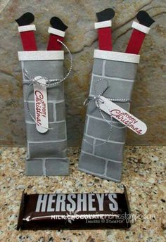 hershey's candy bar wrapped in grey paper with red and white stockings on them