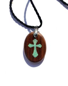 "Looking for unique handmade jewelry?  Perhaps a wood anniversary gift? This pendant is made from your choice of gorgeous woods.  The oval is roughly 1.4\" tall by 1.1\" wide.  The inlay is real turquoise stone sourced in the US.  The finish consists of multiple coats of gloss spar urethane.  This variety of urethane is great for wooden jewelry.  Designed for boats, it holds up very well against the elements and wear.  It also provides uv protection to reduce fading of the wood's natural tone. Artisan Wooden Jewelry As A Gift, Artisan Wood Jewelry Gift, Oval Inlay Necklace Gift, Spiritual Wood Jewelry For Gifts, Spiritual Natural Wood Jewelry Gift, Oval Necklace With Inlay As Gift, Carved Oval Necklaces For Gifts, Carved Oval Necklace For Gift, Oval Carved Necklace For Gift