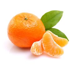 an orange and two pieces of fruit with leaves