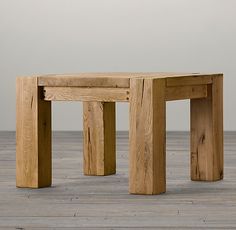 a wooden table sitting on top of a hard wood floor