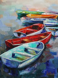 three boats are sitting on the water