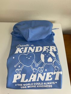 Together we can create a kinder planet by spreading kindness and love <3  Order your super soft and cozy hoodie in Carolina Blue with the white vinyl design. The sizing is unisex adult!  Note: this is a heat transfer design on the back of a hooded sweatshirt:) the front is blank! Please let me know if you have any questions! Playful Cotton Hoodie With Graphic Print, Spreading Kindness, Heat Transfer Design, Spread Kindness, Embroidery Sweatshirt, Cozy Hoodie, Blue Hoodie, Together We Can, Embroidered Sweatshirts