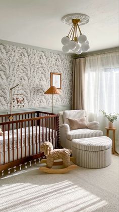 a baby's room with a crib and rocking chair