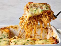 a casserole dish is being lifted with a spatula from the casserole