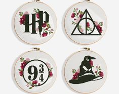 harry potter cross stitch hoop hangings with flowers and hogwart's house on them