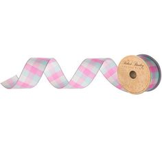 a roll of pink and blue plaid ribbon with a spool of thread on the end