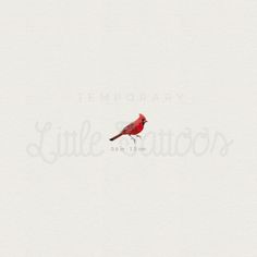 a red bird sitting on top of a white sheet with the words temporary written below it