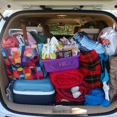 the trunk of a car filled with various items