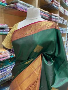 Envelope yourself in the beauty of this exquisite Kanjeevaram Silk Saree NK- 014. Crafted from the finest silk, this saree exudes luxury and sophistication. Feel the natural texture of this gorgeous piece as you make a statement at your next special occasion. Ready to Ship! Kanjeevaram Silk Saree, Green Street, Bridal Stores, Grand Opening, Natural Texture, Silk Saree, Silk Sarees, The Beauty, Latest Fashion