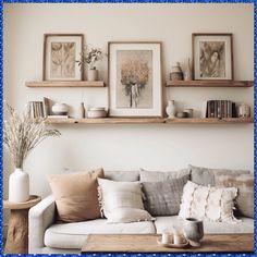 a living room filled with lots of furniture and pictures on the wall above it's shelves