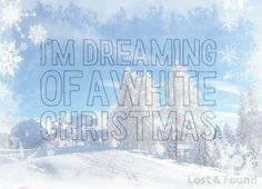 the words i'm dreaming of a white christmas are in front of snow covered trees