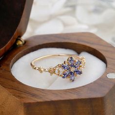 Vintage Tanzanite and Pink Tourmaline Ring - Solid 14K Yellow Gold Flower Cluster Band - Wide Floral Wedding Anniversary Jewelry Gift Radiant Jewelry takes pride in offering handcrafted engagement rings that undergo rigorous quadruple-checks to ensure the highest quality. PRODUCT INFORMATION >Metal: SOLID 10K  >Main Stone *Center Stone: Blue Tanzanite *Size & Shape: 4X2mm Marquise Cut >Side Stones: *Center Stone: Cubic Zircon / Moissanite / Diamond *Size & Shape: Round Cut PRODUCTION Radiant Jew Zirconium Ring, Dainty Gold Ring, Handcrafted Engagement Ring, Dainty Gold Rings, Pink Tourmaline Ring, Engagement Rings Marquise, Tourmaline Jewelry, Floral Ring, Tanzanite Ring