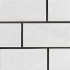 a white brick wall with black lines on it