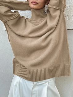 UOOZEE Cream Solid Winter Sweater, Beige Crew Neck Acrylic Top, Beige Acrylic Crew Neck Top, Beige Solid Color Winter Sweater, Khaki Knit Tops For Fall, Cozy Beige Acrylic Top, Casual Beige Acrylic Tops, Khaki Long Sleeve Sweater For Layering, Beige Knit Sweater Solid Color