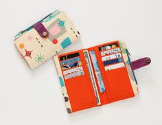 Hi! Thanks for been here this is a large bifold wallet, it has: 10 card slots ,1 zipper pouch, 2 back spaces for bills. -the exterior fabric atomic print cotton fabric. -the interior fabric is orange color -the zippers is teal color -the strap closure it was made with waxed canvas (waterproof) in bodacious pink color, -the metal button is old gold color. Enjoy the colors and warmth that a truly handmade wallet will bring into your daily life. My wallets are quality and efficiency in space and co Retro Wallets With Interior Card Slots, Retro Wallets With Card Slots For Everyday Use, Retro Bifold Wallet For Everyday Use, Retro Rectangular Wallets For Everyday Use, Retro Everyday Rectangular Wallets, Everyday Retro Rectangular Wallets, Retro Wallets With Interior Card Slots For Daily Use, Retro Wallet With Interior Card Slots, Mid Century Art Deco