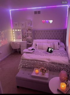 a bedroom with lights on the wall and a bed in it's center area