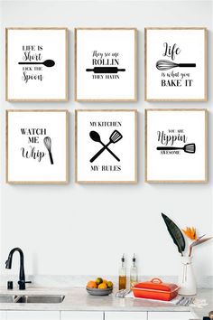 four kitchen wall art prints hanging on the wall