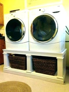 a washer and dryer stacked on top of each other in a laundry room