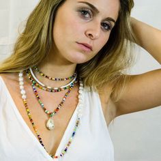 "Bright, vibrant beads make this necklace perfect addition to your summer sundress or a white blouse. African glass beads and white freshwater pearls are hand knotted along the silk cord to create a colorful and bright strand. Alone or layered with your favorites, this necklace exudes a playful, eclectic bohemian elegance. Necklace: 43\" Layer this necklace with: https://www.etsy.com/listing/637252353/baroque-pearl-and-turquoise-necklace?ref=shop_home_active_2 You might also like: https://www.et Summer Multi-strand Colorful Beaded Necklaces, White Tiny Beads Strand, Summer Multi-strand Beaded Necklaces, White Beaded Strand Beads, White Tiny Beaded Necklaces For The Beach, White Handmade Strand Jewelry, Handmade White Strand Jewelry, White Necklace For Festivals, Beach Pearl Chain Shell Necklace