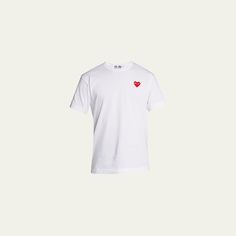 Comme des Garcons jersey T-shirt with signature heart graphic at chest. Crew neckline. Short sleeves. Pullover style. Cotton. Imported. Cdg Heart Shirt, Short Sleeve Cotton T-shirt With Heart Graphic, Playful Cotton T-shirt With Heart Graphic, Comme Des Garcons Men, Black Cotton T-shirt With Heart Graphic, Comme Des Garcons Play Tshirt, Jersey Tshirt, Pullover Styling, Short Sleeves