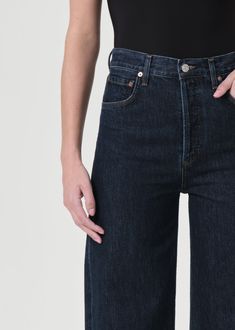 The Ren Jean is designed with a flattering high-rise waist, a relaxed fit through the hips, and finished with a wide leg silhouette. Pair back to a sleek tank or bodysuit. This fit is true to size. Looks Like: Saturated dark indigoFeels Like: Zero-stretch, rigid cotton with a soft finish Agolde Jeans, Dark Indigo, Wide Leg Denim, British Indian, Shirt Accessories, Trinidad And Tobago, Stretch Denim, Inside Out, Dark Blue