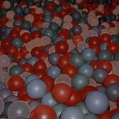 many balls are arranged in rows on the floor