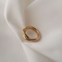 Our elegant yet bold Twist Ring is carefully entwined by hand on high quality metal then dipped in gold. Share a woven bond with someone you cherish or keep this chic statement piece for yourself. Twist Ring Details: Metal Stainless steel, 18K vacuum plated gold. Hypoallergenic, Tarnish-free, Waterproof Perfect your Parure by pairing our Twist Ring with Figaro Link Bracelet and Classic Twist Hoops. Minimalist Twisted Gold Rings, Gold Rings With A Modern Twist, Twisted Gold Ring For Gift, Twisted 14k Gold Ring, Gold Twisted Promise Ring, Gold Rings With A Modern Twist For Promise, Gold Midi Rings With A Modern Twist, Elegant Gold Midi Rings With Infinity Shape, Elegant Gold Infinity Midi Rings