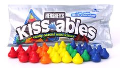 a bag of hershey's kissables candy coated with colored mini kisses