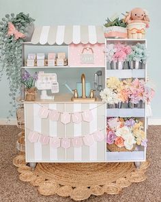 a flower shop with pink and white decor