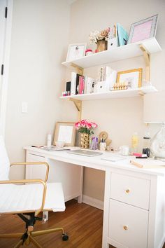 a white desk and chair in a room