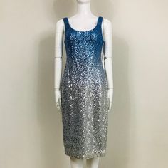 Nicole Miller New York Cocktail Dress Features Allover Metallic Sequin Ombr. Scoop Neckline; V Back. Sleeveless. Concealed Back Zip With Hook And Eye Closure. Sheath Silhouette. Hem Hits The Knee. Back Walking Vent. Color: Blue, Silver. Fabric: 100% Polyester. Lining: 100% Polyester. Size: 2. Measurements When Garment Laid Flat Approximately - Bust: 16.5", Waist: 14.5", Hips: 17.5", Length: 42". Nwt. Never Worn. Can Provide More Info And Pictures Upon Request. Silver Sleeveless Sequin Evening Dress, Metallic Sleeveless Sequin Dress, Sleeveless Silver Sequin Evening Dress, Silver Sleeveless Sequin Dress For Evening, Sleeveless Silver Sequin Dress For Party Season, Silver Sleeveless Sequin Cocktail Dress, Fitted Sleeveless Silver Sequin Dress, Blue Sleeveless Sequin Dress For Spring, Metallic Fitted Sleeveless Sequin Dress