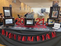 the table is decorated with red and black decorations for an anniversary or other special occasion