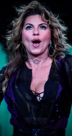 a woman with her mouth open on stage