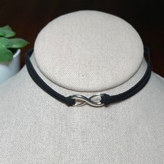 Black Suede Silver Tone Infinity Choker Necklace, 12.5”-14.25” On A 2 Strand Black Suede Cord With Lobster Clasp. Please See Photos For Details. Tags: Trendy, Modern, Goth, Punk, Emo Black Adjustable Infinity Jewelry, Adjustable Nickel-free Infinity Necklace, Black Sterling Silver Choker, Modern Goth, Infinity Necklace Silver, Silver Link Necklace, Pandora Necklace, Black Choker Necklace, Unicorn Necklace