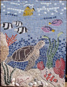 a mosaic tile with sea animals and fish on it