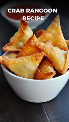 some food is in a white bowl on a wooden table with the words crab rangoon recipe above it