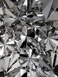 an array of shiny diamonds are shown in black and white