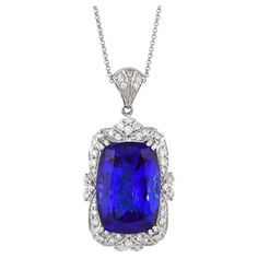 This collection features a selection of the most tantalizing Tanzanites. This enchanting East African gemstone can only be procured from one mine in the foothills of Mount Kilimanjaro, Tanzania. We have accented the rich purple-blue hues of this gemstone with diamonds set in white gold to present a rich and regal look. Classic tanzanite pendant in 18K white gold with diamonds. Tanzanite: 23.41 carat cushion shape, 20.21X14.11mm size. Diamonds: 0.854 carat, G colour, VS clarity. Gold: 8.55g, 18K Kilimanjaro Tanzania, Tanzanite Pendant, Mount Kilimanjaro, Neck Jewelry, Tanzanite Jewelry, Rich Purple, Neck Jewellery, Naha, Stone Collection