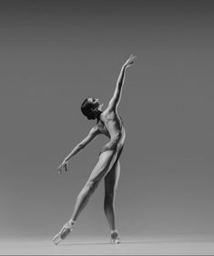 a ballerina in black and white poses for the camera