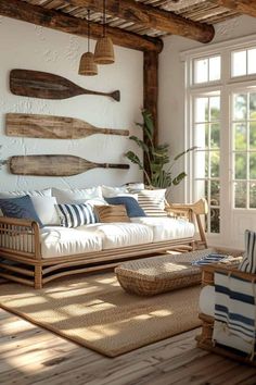 a living room filled with furniture and lots of wood planks on the wall next to windows