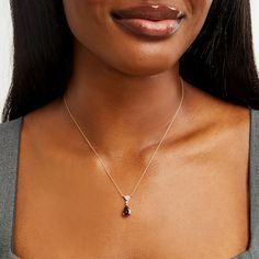 Celebrate a special occasion in this stunning gemstone and diamond necklace. 10K gold The rope chain necklace is centered with a triangular frame set with shimmering diamonds A single diamond connector joins the frame to the 10.0 x 7.0mm pear-shaped rhodolite garnet drop 1/15 ct. t.w. of diamonds 18.0-inch necklace; spring-ring clasp Elegant Formal Birthstone Necklace With 17 Jewels, Elegant Teardrop Pendant Birthstone Necklace For Anniversary, Elegant Birthstone Necklace With Diamond Accents For Formal Occasions, Elegant Birthstone Necklace With Gemstone Accents, Elegant Teardrop Pendant Birthstone Necklace, Pear-shaped Diamond Birthstone Necklace, Elegant Yellow Gold Teardrop Birthstone Necklace, Formal Birthstone Necklace Fine Jewelry, Teardrop Gemstone Diamond Necklace For Anniversary