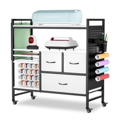 an ironing board and sewing machine on wheels with craft supplies in the bottom drawer