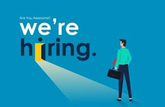 a man standing in front of a blue background with the words we're hiring